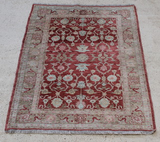 A Caucasian style rug with floral field to the centre 73" x 59" 