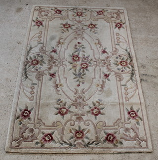 A cream and floral ground Chinese rug 95" x 61" 