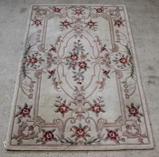 A cream ground and floral patterned Chinese rug 95" x 60" 
