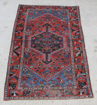 A red and blue ground Persian Toyserkan rug with central medallion 83" x 53" 
