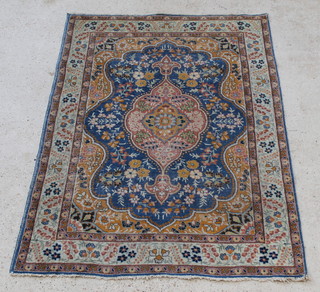 A blue and yellow ground Persian Tabriz rug with central medallion 75" x 54"