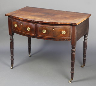 A 19th Century mahogany bow front side table with cross-banded top fitted 1 long drawer, raised on turned supports 29"h x 37"w x 24"d 