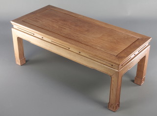A rectangular Chinese Padouk coffee table, raised on square supports 17"h x 40"w x 18"d 
