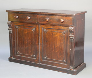 An early Victorian rosewood chiffonier fitted 2 drawers above a double cupboard enclosed by panelled doors and with fluted columns to the sides 34"h x 47"w x 16 1/2"d 