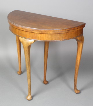 A 1930's Queen Anne style walnut demi-lune card table, raised on club supports 29"h x 30"w x 15"d 