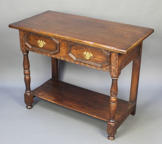 A 17th Century style oak side table with frieze drawer and geometric mouldings, raised on turned and block supports with undertier 30"h x 39"w x 20"d 