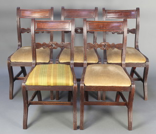 A set of 6 carved mahogany bar back dining chairs with carved and pierced mid rails, upholstered drop in seats, 