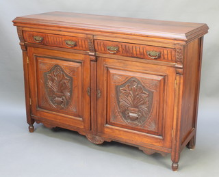 A Victorian carved walnut sideboard fitted 2 drawers above double cupboards enclosed by panelled doors, raised on turned supports 38"h x 53"w x 20"d 