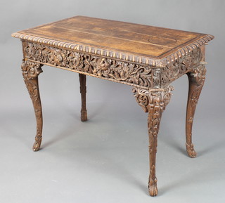 A Georgian heavily carved oak centre table fitted a frieze drawer, raised on carved cabriole supports 29" x 28 1/2"w x 23"d 