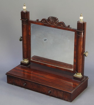 A Regency rectangular plate dressing table mirror contained in a mahogany frame supported by 2 columns the base fitted a drawer 24"h x 24"w x 11 1/2"d  