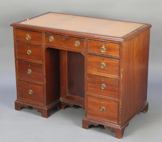 A Victorian mahogany kneehole pedestal desk with brown inset writing surface above 1 long and 6 short drawers, the pedestal fitted a cupboard enclosed by panelled door, raised on bracket feet 30"h x 39"w x 22"d 