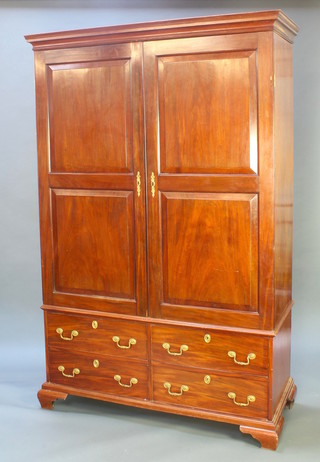 A 19th Century mahogany Channel Islands "knock down" press cabinet, the upper section with moulded cornice, the interior fitted shallow trays above 4 drawers with brass swan neck drop handles, raised on bracket feet  84"h x 54 1/2"w x 24"d 