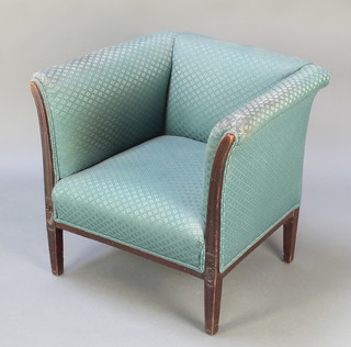 A Georgian style mahogany armchair upholstered in blue material raised on square tapered supports 