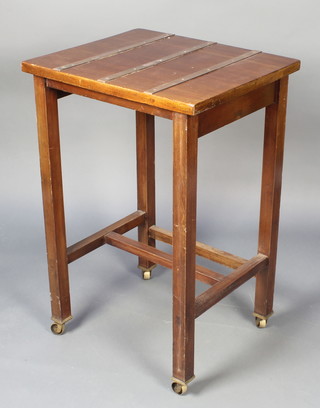 A rectangular mahogany trolley/occasional table with brass banding, raised on square tapering supports, brass caps and castors 36"h x 23 1/2"w x 19 1/2"d 