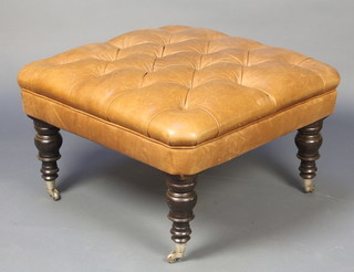 A square footstool upholstered in buttoned leather 37"h x 29"
