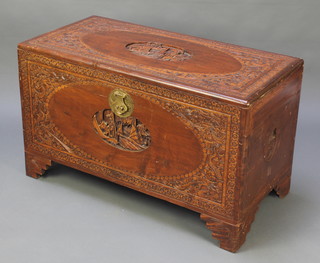 A carved camphor coffer with hinged lid 23"h x 40"w x 20"d 