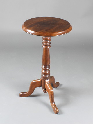 A Victorian circular mahogany wine table raised on pillar and tripod supports 28"h x 16" diam. 