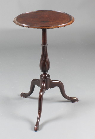 An Edwardian Chippendale style circular mahogany wine table raised on spiral turned column and tripod base 25"h x 14" diam. 
