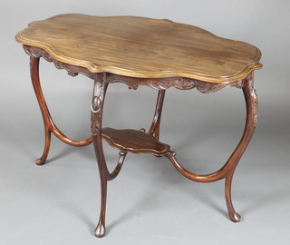 An Edwardian oval shaped mahogany centre table of serpentine outline, raised on shaped supports with undertier 29"h x 42"w x 29"d 