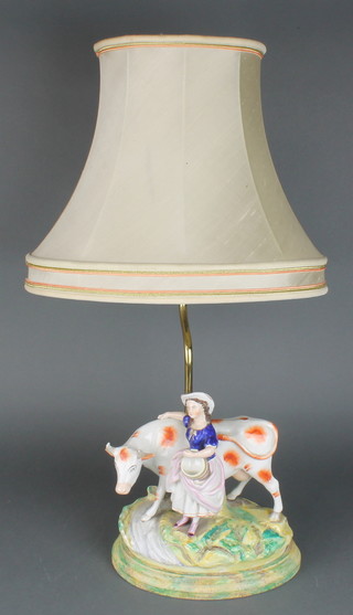 A Victorian Staffordshire group of a milkmaid and cow converted to electricity 9" 