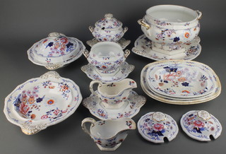 A 19th Century H & R Daniel ironstone Japan Group pattern dinner service comprising 41 large plates, 16 medium plates, 13 small plates, 21 soup bowls, 12 meat plates, a vegetable dish and cover, a sauce tureen, cover and stand, 2 sauce boats, a tureen stand, 2 small tureen lids and 1 tureen base, 4 dishes and 1 bowl 