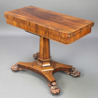 A William IV rosewood fold-over card table, raised on a hexagonal column with quatrefoil base and claw feet 29 1/2"h x 36"w x 36"d 
