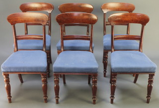 A set of 6 19th Century mahogany bar back dining chairs with plain mid rails and over stuffed seats, raised on turned supports 