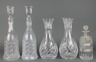 A pair of pressed glass mallet shaped decanters and stopper 14", 2 glass vases and a faceted scent bottle 