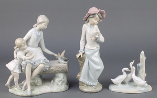 Three Lladro groups a girl with dove 9 1/2", a group of geese 4" and a mother and child sitting on a bench with birds 10" 