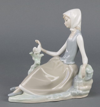 A Lladro group of a seated lady with dove 7", boxed