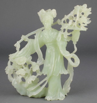 A 20th Century carved jadeite figure of a lady standing beside flowers with hardwood stand, boxed 9"
