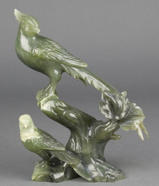 A carved Chinese jadeite figure of 2 exotic birds on a hardwood stand 8", boxed