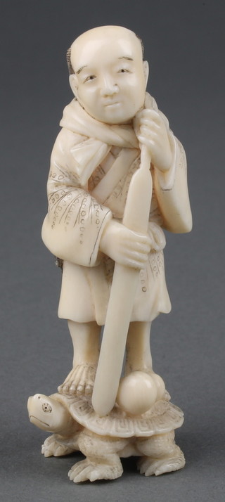 A Japanese Meiji period carved ivory okimono of a man standing on a tortoise with a gourd at his feet 3" 