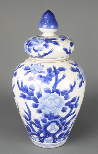 A Japanese blue and white oviform vase decorated with peony 19" 