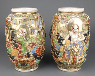A pair of early 20th Century Japanese moulded Satsuma vases decorated with deities 10" 