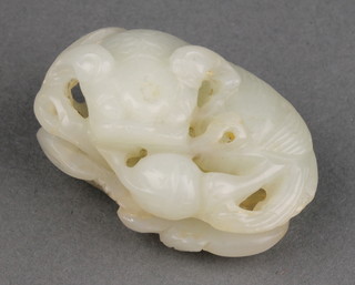 A 20th Century jade carving of a shi shi with a peach 1 3/4" 