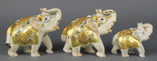 Three Indian carved and painted alabaster figures of elephants 6" and 4"