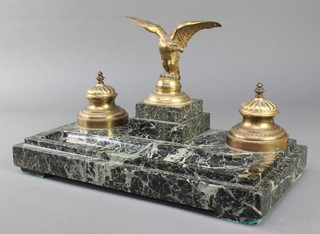 A 19th Century gilt metal and polished granite 2 bottle inkwell surmounted by a figure of an eagle with wings outstretched 8" x 14" x 7 1/2" 