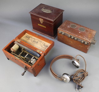 A Victorian improved patent magneto electric shock machine, the base and drawer missing, a Gecophone "crystal" set, a Gecophone twin section box with hinged lid containing a pair of BBC head phones Reg no. 691375

