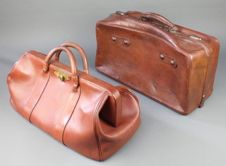 Two leather Gladstone bags 8" x 18" x 10" and 10" x 19" x 8", one with part of old GWR label 