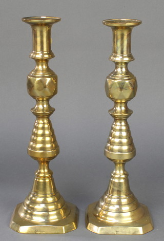 A pair of Victorian brass candlesticks with knopped stems 12" 