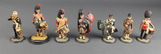 Seven various painted model soldiers - a state drum Major, a Gurkha piper, 1 other piper and 5 drummers
