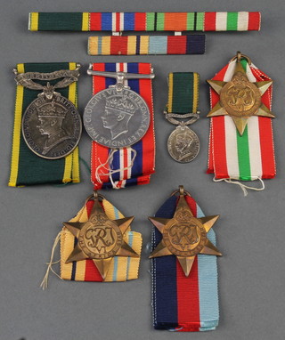 A George VI issue Territorial Efficiency medal to Lieutenant W.D.Cutler. Royal Armoured Corps, do. miniature medal, 39-45 Star, Africa Star, Italy Star and British War medal together with a ribbon bar 
