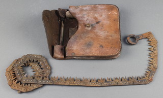 A First World War steel military issue chain saw complete with leather pouch 