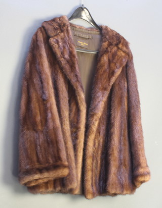 A lady's quarter length mink coat by Charles Moss Furs