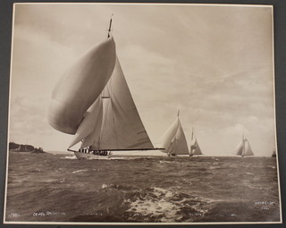 Beken & Sons of Cowes, a silver gelatine hand printed photograph of Cowes Regatta with the yachts Candida, Cambria, Astra and Westwood, negative number 15350, dated 1930 and signed in white ink  9" x 11" 