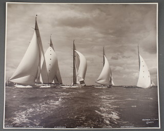 Beken & Sons of Cowes, a silver gelatine hand printed photograph of the yachts Velsheda, Candida, Shamrock V, Astra and Britannia, negative number 18851, signed in white ink 1934, 9" x 11" 