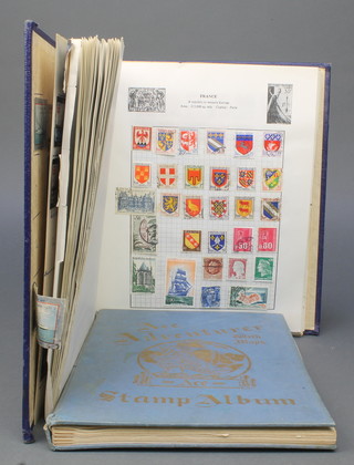 A blue Ace Adventure album of used World stamps and 1 other album of used World stamps