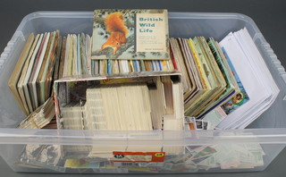 A large quantity of tea card albums and loose tea cards 