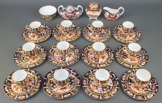 A Royal Crown Derby Japan pattern coffee set comprising 12 coffee cups, 12 saucers, 12 plates, a lidded bowl and cover, sugar bowl, slop bowl, cream jug 